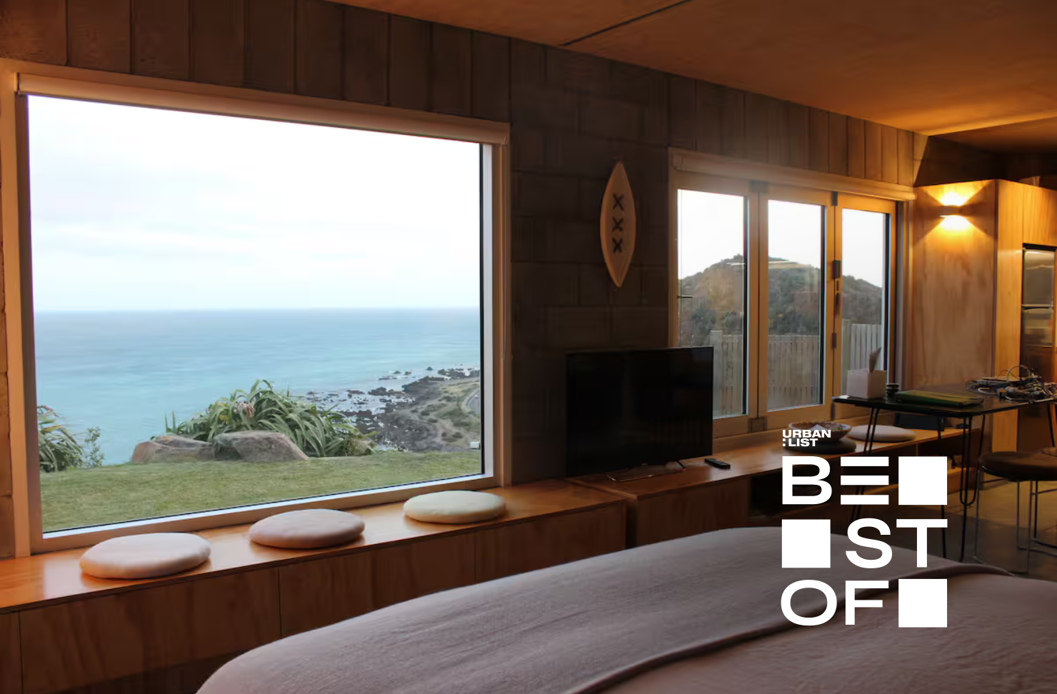 Sea views from the window of a cliff-side Wellington airbnb.